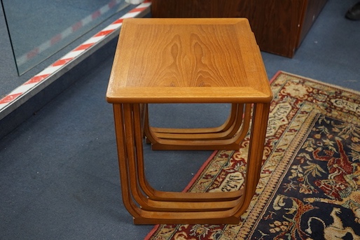 A nest of three Parker Knoll teak occasional tables, width 48cm, depth 42cm, height 49cm